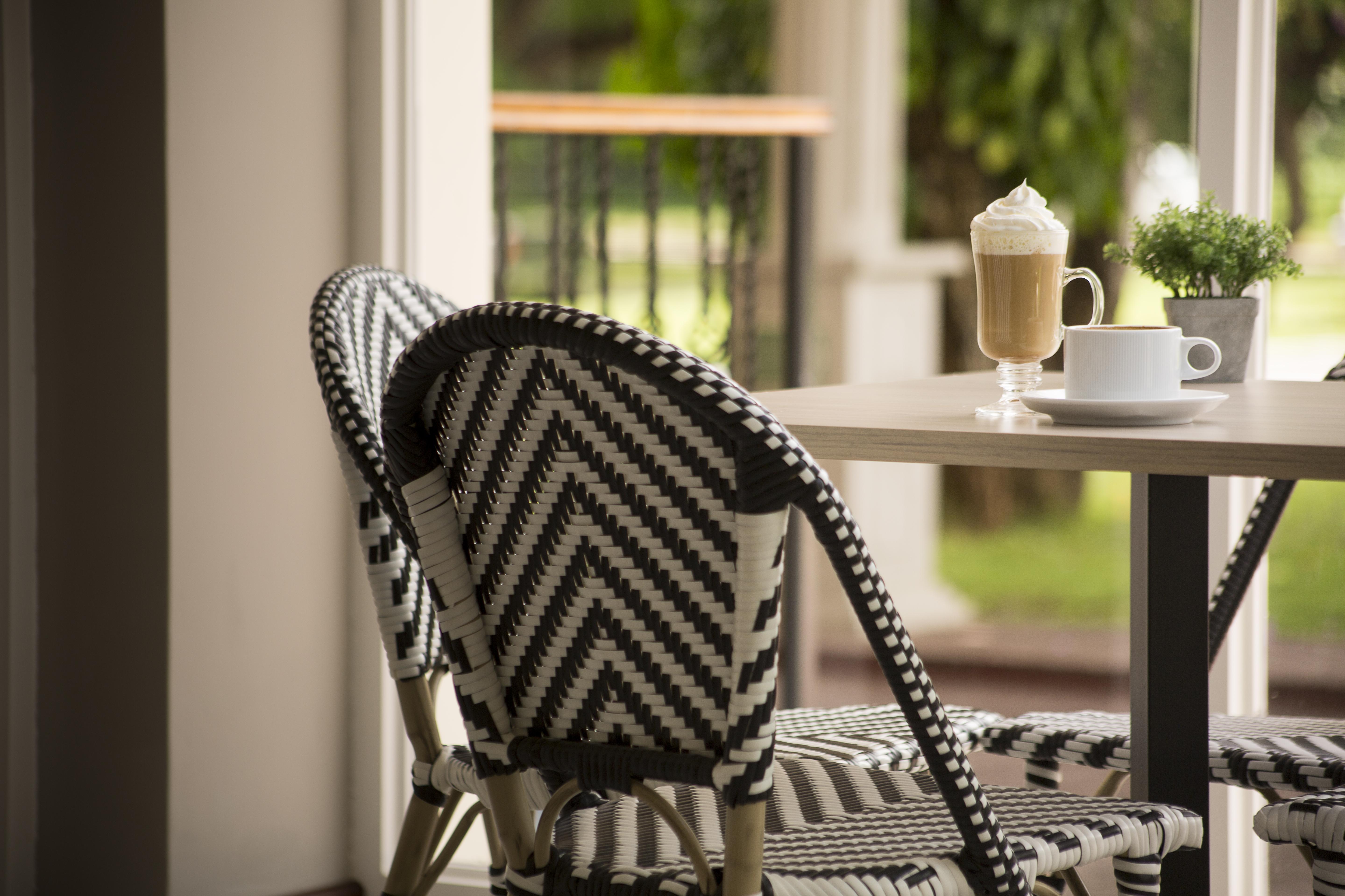 Radisson Hotel Panama Canal Bagian luar foto A typical bistro chair